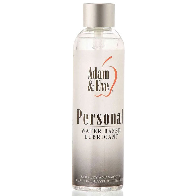 A clear plastic bottle of Adam & Eve Personal Water-Based Lubricant, featuring a silver cap and a red apple design label, highlights its silky smooth texture and latex compatibility for long-lasting pleasure.