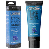 The image features a tube and box of GoodHead Slick Head Glide - Blue Raspberry, a vegan, cruelty-free water-based lubricant. The packaging, decorated with blueberries, promotes enhanced pleasure and reduced friction under the reputable Doc Johnson brand name.