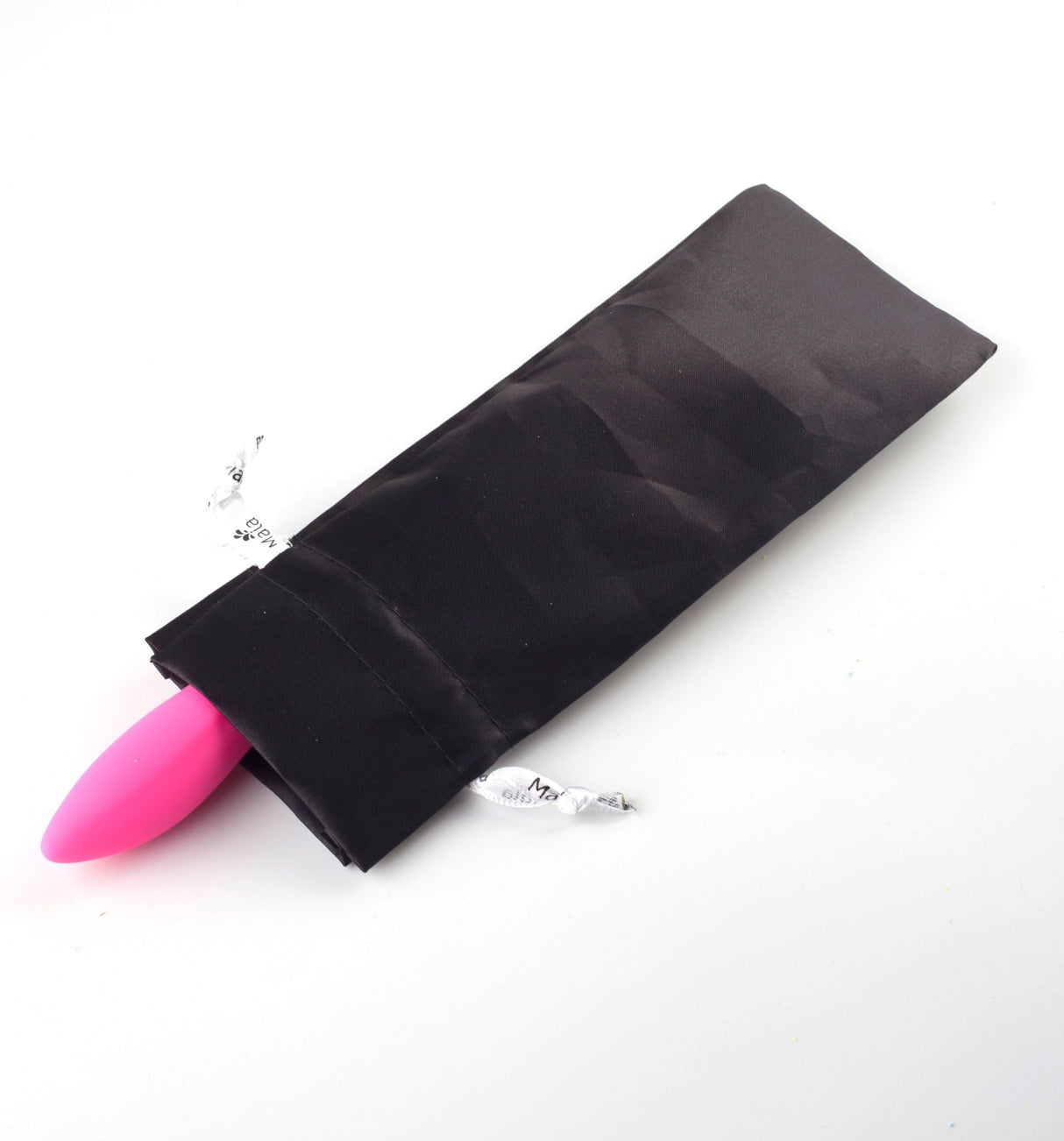 The Maia Victoria - Pink 15.2 cm USB Rechargeable Rabbit Vibrator with dual vibration peeks from a black satin drawstring pouch on a white background, surrounded by bits of shredded paper, highlighting its waterproof design.