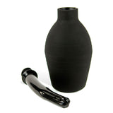 The Adam & Eve Ez Anal Douche includes a black enema bulb with a smooth, matte finish and a ribbed texture for grip. Its slender, glossy nozzle features a slight curve. These components are displayed against a plain white background.