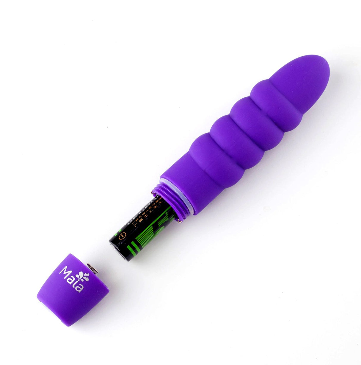 The Maia Sugr is a purple 9 cm silicone bullet massager with a ribbed texture, removable cap engraved Mata, and features vibrating pulsations. Displayed horizontally on a white background, it shows the open battery compartment with a battery inside.