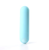 A teal blue, capsule-shaped Maia Jessi 7.6 cm USB Rechargeable Bullet stands vertically against a plain white background, featuring a smooth silicone-coated cylindrical form with slightly rounded ends and a subtle seam near the base.