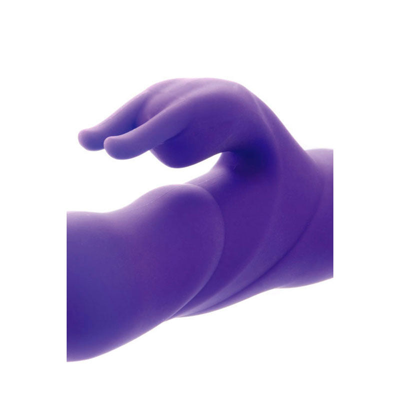 The Adam & Eve THE THRUSTER - Purple 25.4 cm (10) USB Rechargeable Thrusting Rabbit Vibrator is a silicone sculpture with smooth, flowing curves and intertwining elements, evoking motion. Its matte finish enhances the gentle contours and rounded shapes of the thrusting shaft design.