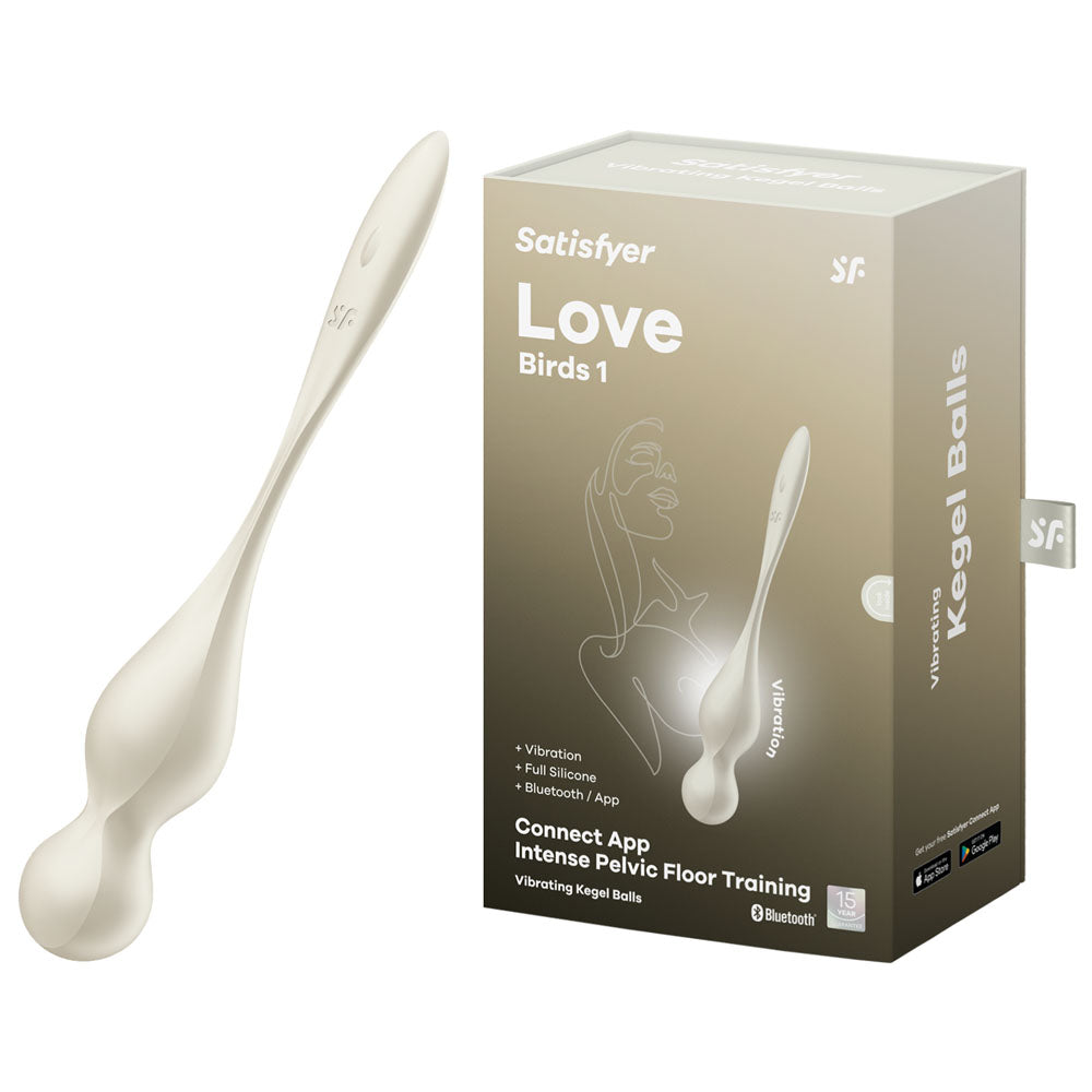 The image features a white vibrating Kegel ball device, the Satisfyer Love Birds 1, alongside its packaging. The box highlights Vibration and Full Silicone, and the device offers advanced pelvic floor training via Bluetooth with the Satisfyer Connect App.