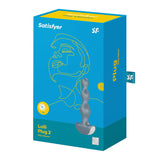 The image shows a sleek blue box for the Satisfyer Lolli-Plug 2 - Gray Vibrating Anal Beads, featuring a line drawing of a face and an illustration of the gray silicone beaded plug vibrator designed for anal pleasure with various vibration settings.