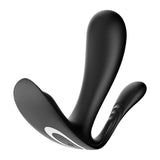 The Satisfyer Top Secret + is a black wearable vibrator with two arms for targeted clitoral and prostate stimulation. Its sleek, curved design features a contrasting white ring, offers ergonomic minimalism, and is compatible with the Satisfyer Connect app.