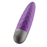 The Satisfyer Ultra Power Bullet 5 - Purple USB Rechargeable Bullet is a purple, oval-shaped device made from body-friendly silicone, featuring a textured diamond pattern and a gray circular base with a small logo. This ergonomic bullet vibe combines style and comfort.