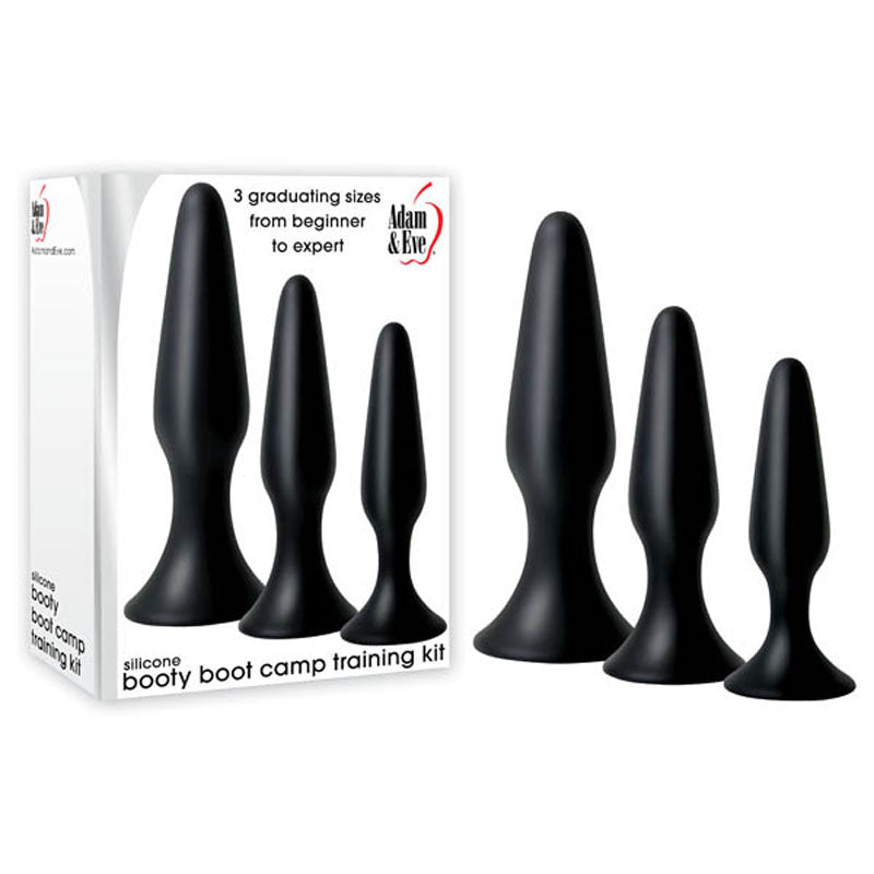 The Adam & Eve Silicone Booty Boot Camp Training Kit, featuring a red apple logo, offers three black silicone butt plugs with graduating sizes from beginner to expert, all next to its packaging.