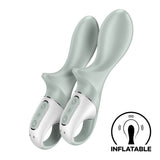 The Satisfyer Air Pump Booty 3 in grey features dual inflatable silicone toys with ergonomic white handles and an intuitive control panel with three circular buttons. The INFLATABLE icon emphasizes its unique, customizable anal training capability. USB rechargeable for convenience.