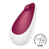 The Satisfyer Spot On 3 is a white and burgundy teardrop-shaped personal massager, ideal for targeted clitoral stimulation. It has a small rounded tip, an embossed sf logo near the base, and includes an illustration of a finger pressing a PUSH button to highlight customizable pleasure.
.