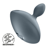 The Satisfyer Booty Absolute Beginners 4 is a sleek, gray, teardrop-shaped butt plug with a curved handle and side button, perfect for beginners seeking new sensations.