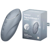 The image displays the Satisfyer Tap & Climax 1 vibrator in bluegrey with its packaging. Made from body-safe silicone, it features plus and minus buttons, a logo, tapping motion, vibration capabilities, and is waterproof.