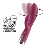 The Satisfyer Spinning Rabbit 1 in red is a dual-action rabbit vibrator with rotation and vibration features. It has a rotating main shaft, a smaller curved extension, various programs, and a silver base supporting its 2-in-1 design.