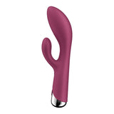 The Satisfyer Spinning Rabbit 1 is a red, USB rechargeable, dual-motor rabbit vibrator with a rotating design. Its main shaft and curved extension offer targeted stimulation with multiple vibration programs, while the metallic silver base adds a contrasting finish.