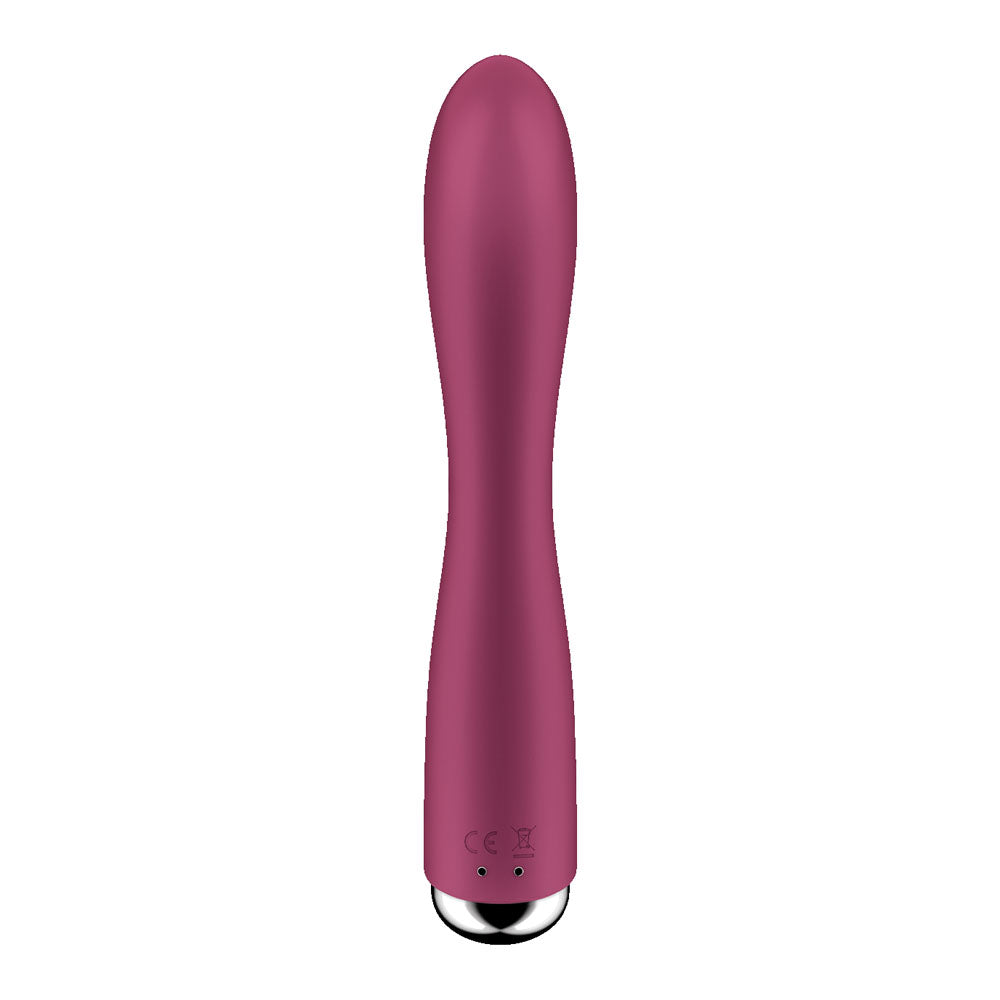 The Satisfyer Spinning Rabbit 1 is a sleek red 20 cm USB rechargeable vibrator with a smooth, curved design featuring a rounded tip, silver metallic base with symbols suggesting various vibration programs, exuding an elegantly modern appearance.