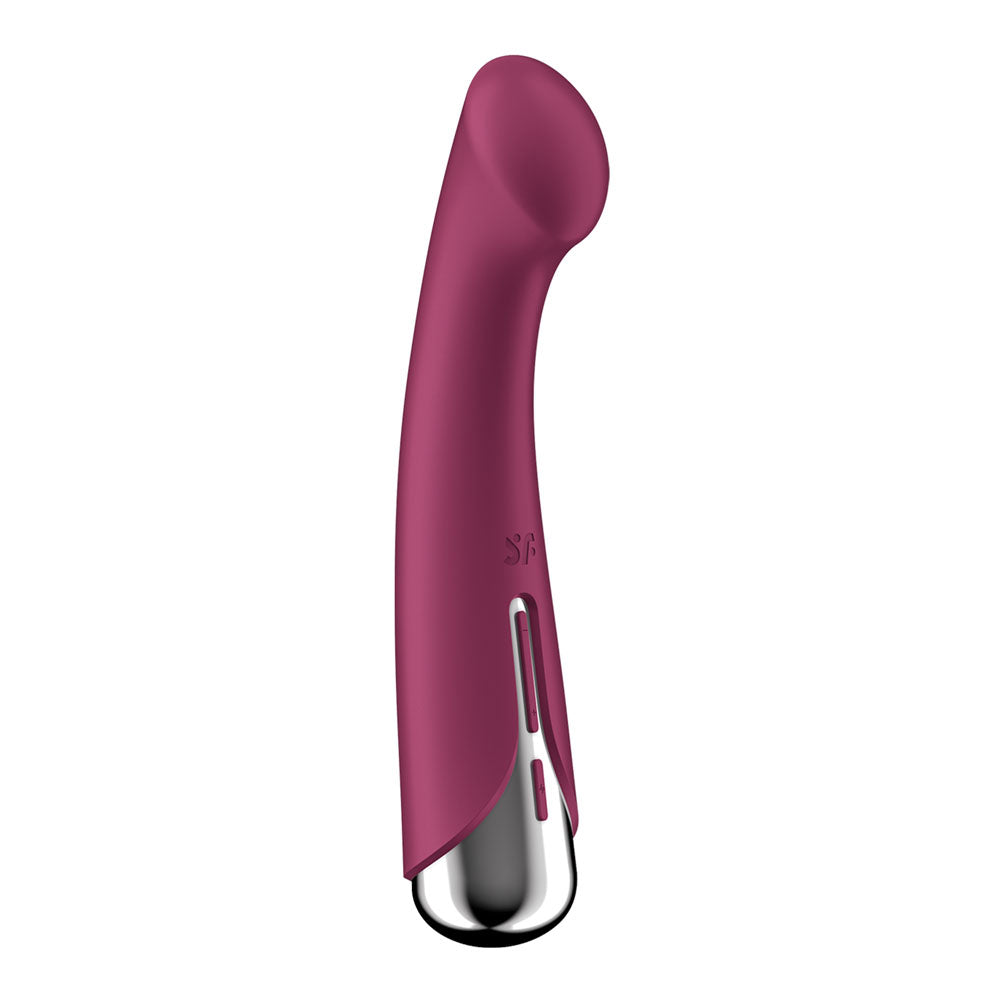 The Satisfyer Spinning G-Spot 1 vibrator in red features a curved design with a smooth, elongated body and a glossy silver base. It includes a vent-like structure near the base and subtly printed SF on the body. Waterproof and USB rechargeable, it measures 16.5 cm.