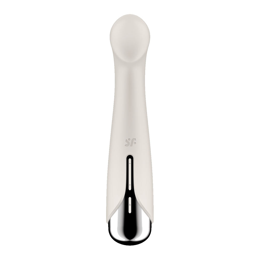 The Satisfyer Spinning G-Spot 1 in beige offers a sleek design with an ergonomic, smooth head. It includes intense vibration modes, a metallic base, and a single control button. The minimalist design focuses on functionality and aesthetics, enhanced by a subtle logo for added elegance.