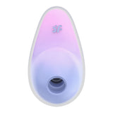 The violet/pink Satisfyer Pixie Dust, featuring a central circular opening and a small f logo, elegantly rests against a white background. This USB rechargeable air pulse stimulator offers innovative clitoral stimulation.