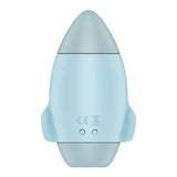 The Satisfyer Mission Control is a light blue, rocket-shaped stimulator with a smooth design, gray tip and base, and two small wings. It features two circular connectors on the bottom and bears the CE mark plus a crossed-out wheelie bin symbol for compliance and disposal.