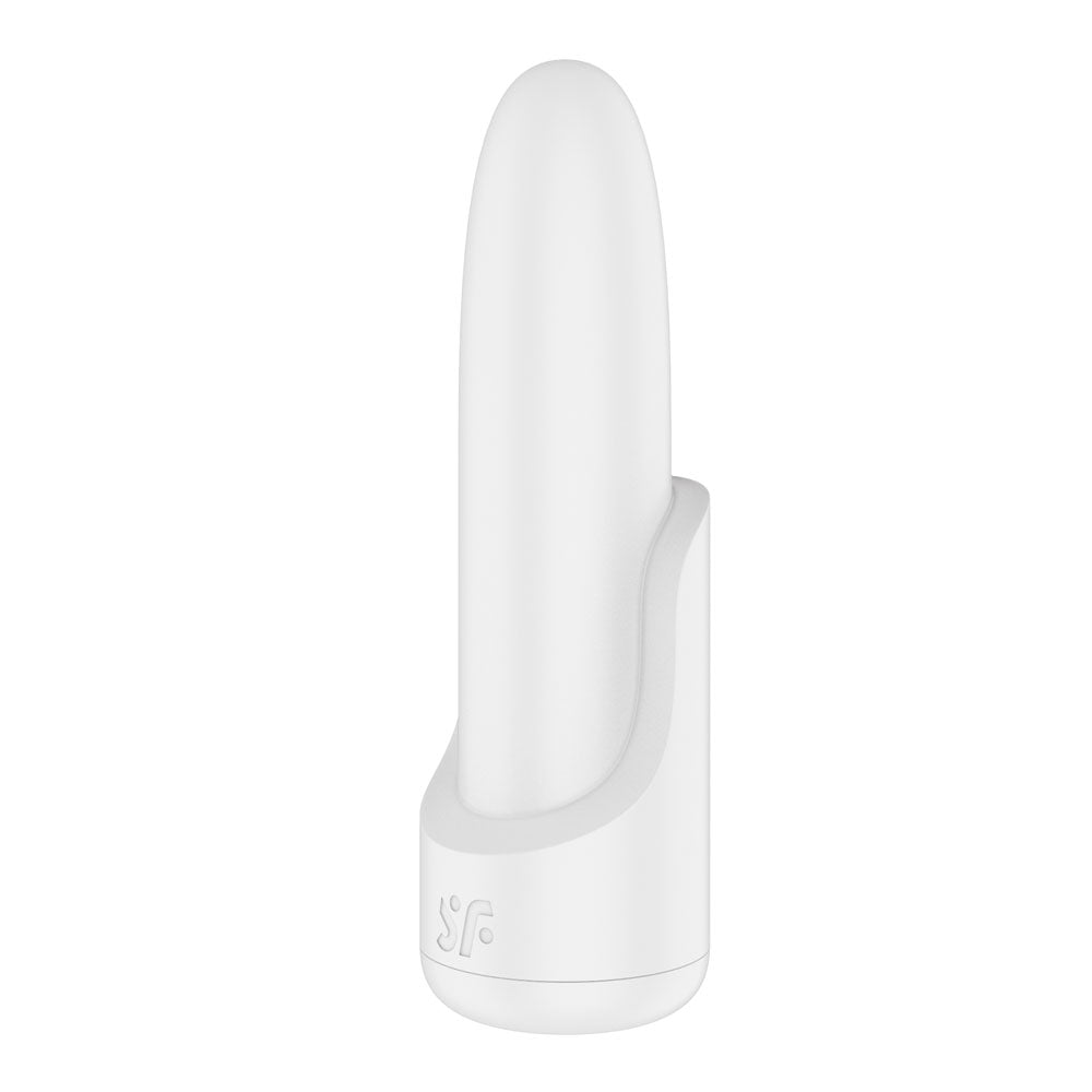 A sleek, white, cylindrical USB rechargeable vibrator with a smooth, rounded top rests on a minimalistic stand. It features an embossed logo on the base and exudes modern elegance reminiscent of the Satisfyer Playful Four with 4 interchangeable options.