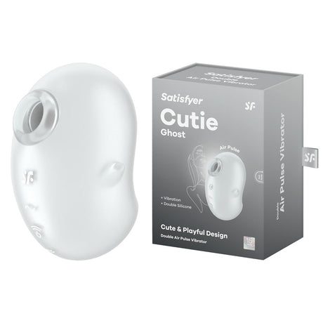 The image displays a white Satisfyer Cutie Ghost, a sexual wellness device, along with its black packaging box featuring product images and details. This sleek, oval-shaped, transparent silicone air pulse stimulator is USB rechargeable and boasts a Cute & Playful Design.