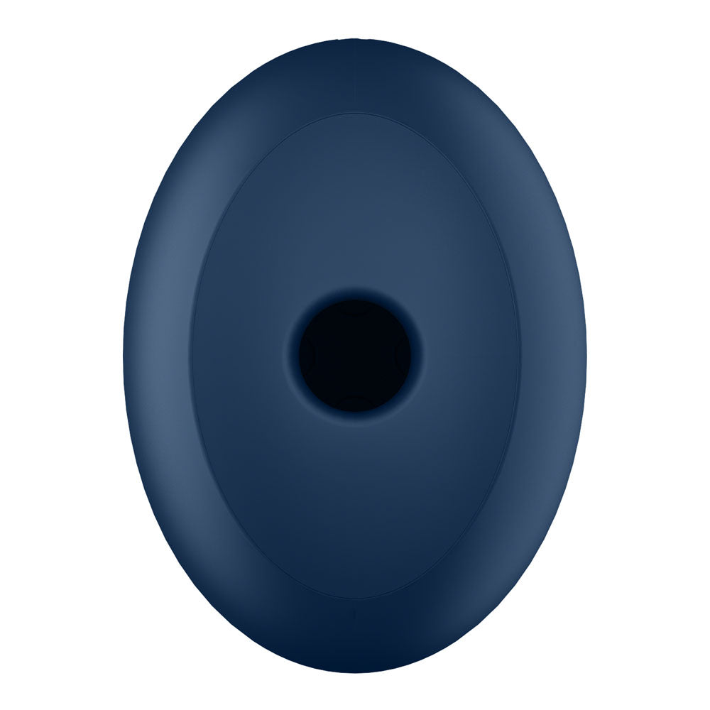 A matte, navy oval-shaped Satisfyer Air Power 4 with a central circular indentation and minimalist design stands out against a plain white background. Its symmetrical form suggests both functionality and an aesthetic appeal.