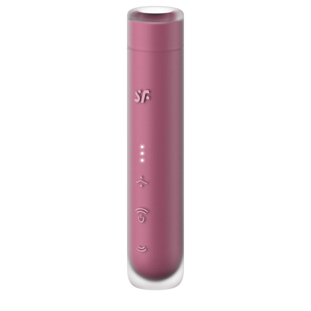 The Satisfyer First Kiss - Pink USB Rechargeable Air Pulse Stimulator is a sleek, cylindrical device with a smooth silicone finish. It has three white LED indicators, tactile buttons for sound control and connectivity, slightly curved top and bottom, and features a stylized logo near the top for exploring pressure wave intensities.