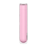 The Satisfyer First Kiss, a cylindrical pink USB rechargeable air pulse stimulator, features a glossy finish with a removable transparent cap. Beneath its subtle silicone layer is a small rectangular LED indicator. It stands vertically, cap side up, against a plain white background.