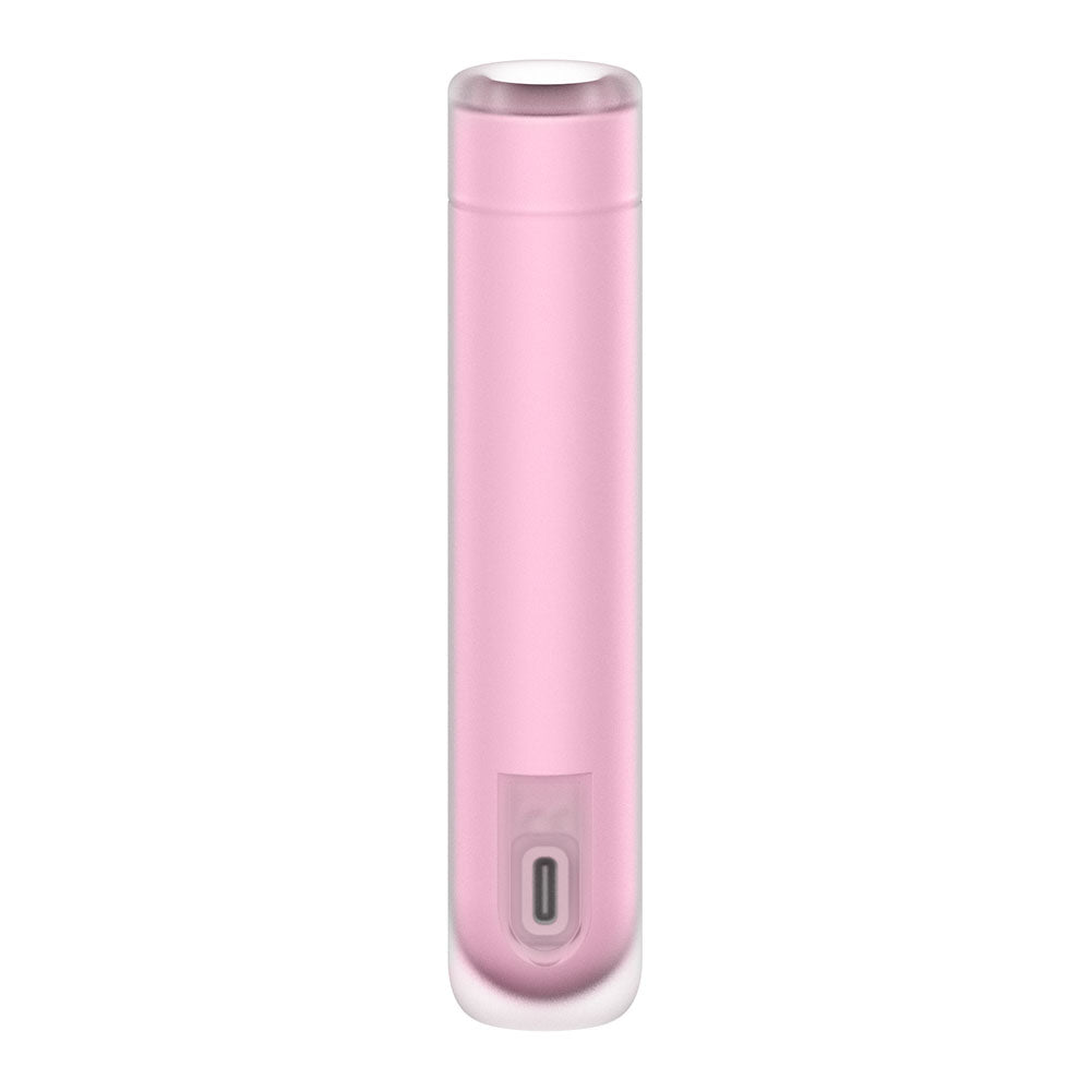 The Satisfyer First Kiss is a sleek, cylindrical pink device with rounded edges and a clear top cap. Its smooth finish conceals a silicone layer for grip, and the USB-C port at the bottom enhances convenience. It offers modern air pulse stimulation with adjustable pressure wave intensities.