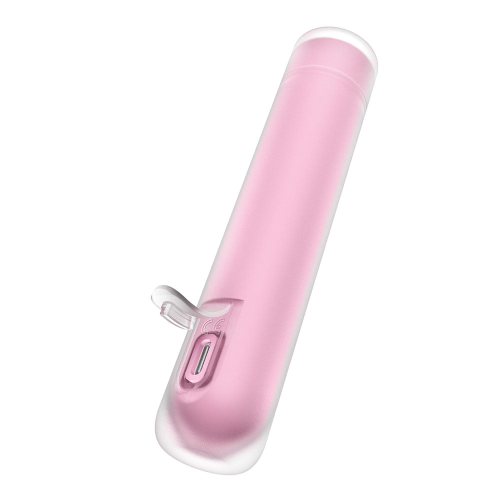 The Satisfyer First Kiss is a sleek, minimalist, pink cylindrical stimulator featuring a transparent cap, silicone layer, side button, and charging port near the base. Its USB rechargeable and offers compact portability with varied air pulse intensities.