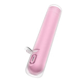 The Satisfyer First Kiss is a sleek, minimalist, pink cylindrical stimulator featuring a transparent cap, silicone layer, side button, and charging port near the base. Its USB rechargeable and offers compact portability with varied air pulse intensities.