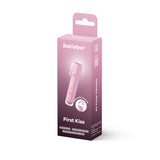 The Satisfyer First Kiss - Pink USB Rechargeable Air Pulse Stimulator features a sleek pink design with white accents, offering 20 intensity levels and control. This travel-size device is quiet, rechargeable via USB, and encased in smooth silicone.