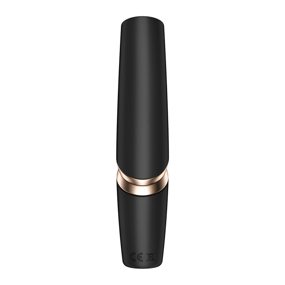 The Satisfyer Perfect Kiss is a sleek, black USB rechargeable air pulse stimulator with an elegant glossy finish, highlighted by a gold band at the center. Its minimalist and reflective design boasts embossed symbols on its lower section, making it perfect for adding allure to your experience.