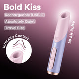 Image of the Satisfyer Bold Kiss - Purple USB Rechargeable Air Pulse Stimulator. This luxury design is travel-sized and absolutely quiet, featuring adjustable pressure wave intensities, control buttons, and an ergonomic top opening.