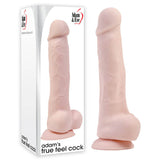 A realistic flesh-toned dildo made from True Feel TPE stands next to its box, showcasing the lifelike design and texture. The packaging highlights the Adam & Eve brand and product name Adams True Feel Cock, underscoring its quality craftsmanship and suction cup base.