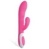 The Adam & Eve The Warming Rabbit G is a pink 21.6 cm (8.5) USB rechargeable silicone vibrator with a sleek, ergonomic design. It features a curved shape with a G-Spot tip, dual stimulation capabilities, and a white base control panel with arrow and circle buttons for intensity and pattern adjustments.