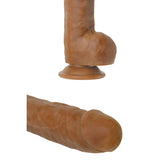 The Adam & Eve Adams Colossal 12 Brown Dong features a skin-toned silicone design with a suction cup base and textured shaft. Its sleek, strap-on compatible design allows for versatile hands-free use.