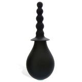 The Adam & Eve Smooth & Easy Silicone Douche in black features a rounded bulb base and long nozzle with multiple spherical bumps and a tapered tip, ideal for anal douching and easy cleaning.