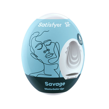 The Satisfyer Masturbator Egg - Savage, with its blue and black oval-shaped packaging, showcases an abstract face line drawing. A cutout on the side displays the cyber-skin textured interior of this white stroker sleeve, perfect as a travel companion.