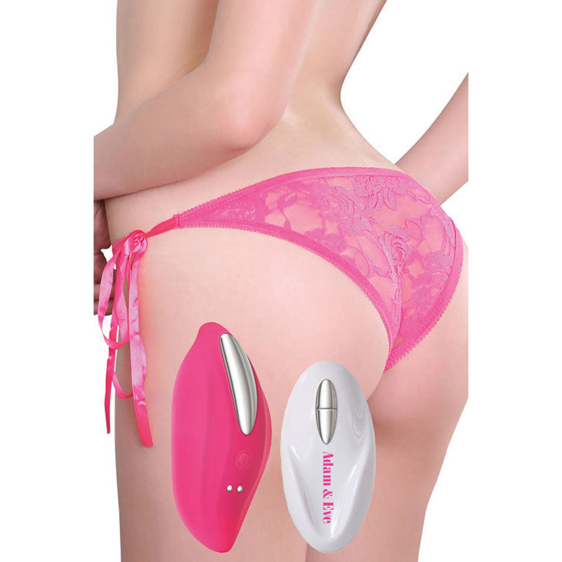 A person wearing pink lace underwear is seen from behind, along with two devices: a sleek pink one and a white one labeled Adam & Eve, resembling a remote control for the Adam & Eve Eves Rechargeable Vibrating Panty With Remote.