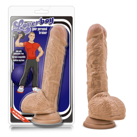 The Loverboy - Your Personal Trainer 22.9 cm (9) brown dildo features a suction base and comes in packaging with a cartoonish muscular man illustration. It highlights its realistic feel, body-safe materials, skin safety, and waterproof properties.