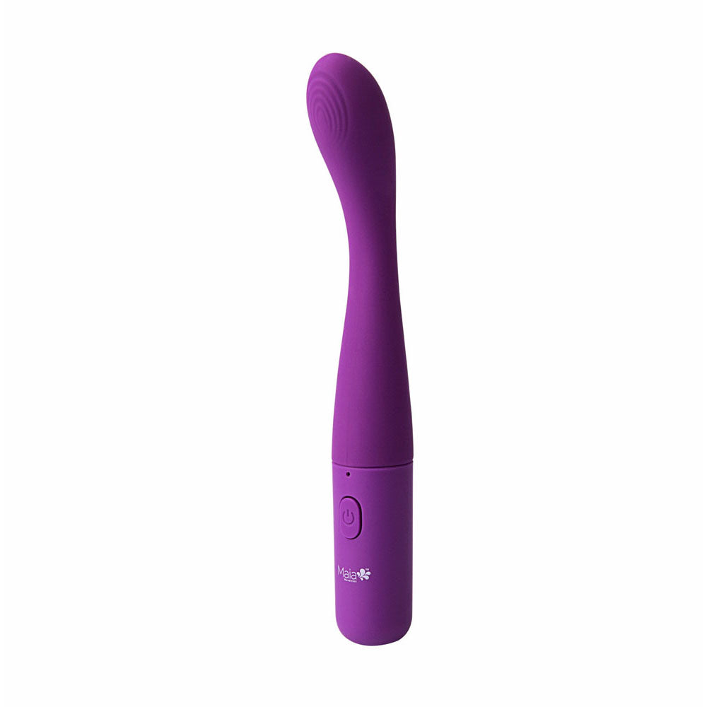 A purple Maia CHELSI vibrator stands upright against a white background, highlighting its smooth ergonomic design with a tapered end. Made from medical-grade silicone, it features a flower-adorned power button and offers 10 vibration levels for personalized pleasure.