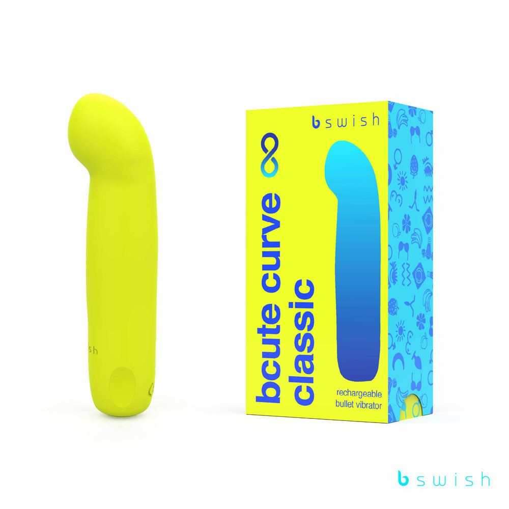 The image shows a citrus yellow Bcute Curve Infinite Classic vibrator made of body-safe silicone, standing next to its box. The blue packaging with yellow accents reads b swish, bcute curve classic, and identifies it as a USB rechargeable waterproof bullet vibrator.