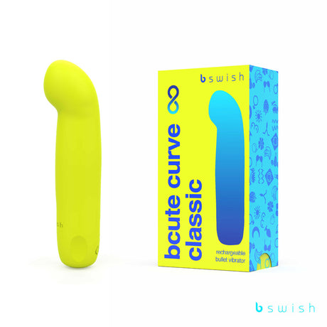 The image shows a citrus yellow Bcute Curve Infinite Classic vibrator made of body-safe silicone, standing next to its box. The blue packaging with yellow accents reads b swish, bcute curve classic, and identifies it as a USB rechargeable waterproof bullet vibrator.