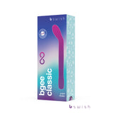 The Bgee Infinite Classic packaging showcases a purple and turquoise design with a silhouette of the pink curved G-spot wand. The front labels it as a G-spot vibrator, features the Bswish logo at the top, and includes an infinity symbol to indicate its waterproof feature.