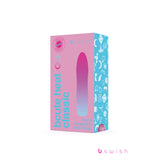 The image shows a product box for the Bcute Infinite Heat Classic Sunset Pink vibrator, featuring waterproof and USB rechargeable details. The packaging displays the brand logo and delicate white patterns on the blue section.