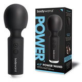 The image shows the black Bodywand 4.5 Power Wand, a USB rechargeable massager with muscle stimulation features, next to its box. The device has a bulbous head and power button, while the packaging highlights its intense vibrations and user-friendly controls.