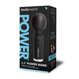 A box labeled Bodywand 4.5 Power Wand exhibits the 11.4 cm USB Rechargeable Massager Wand, ideal for enhancing sexual well-being. The package shows a sleek black wand with a round head and button, featuring blue and white text highlighting its intense vibrations and easy controls, plus an image of it in use.