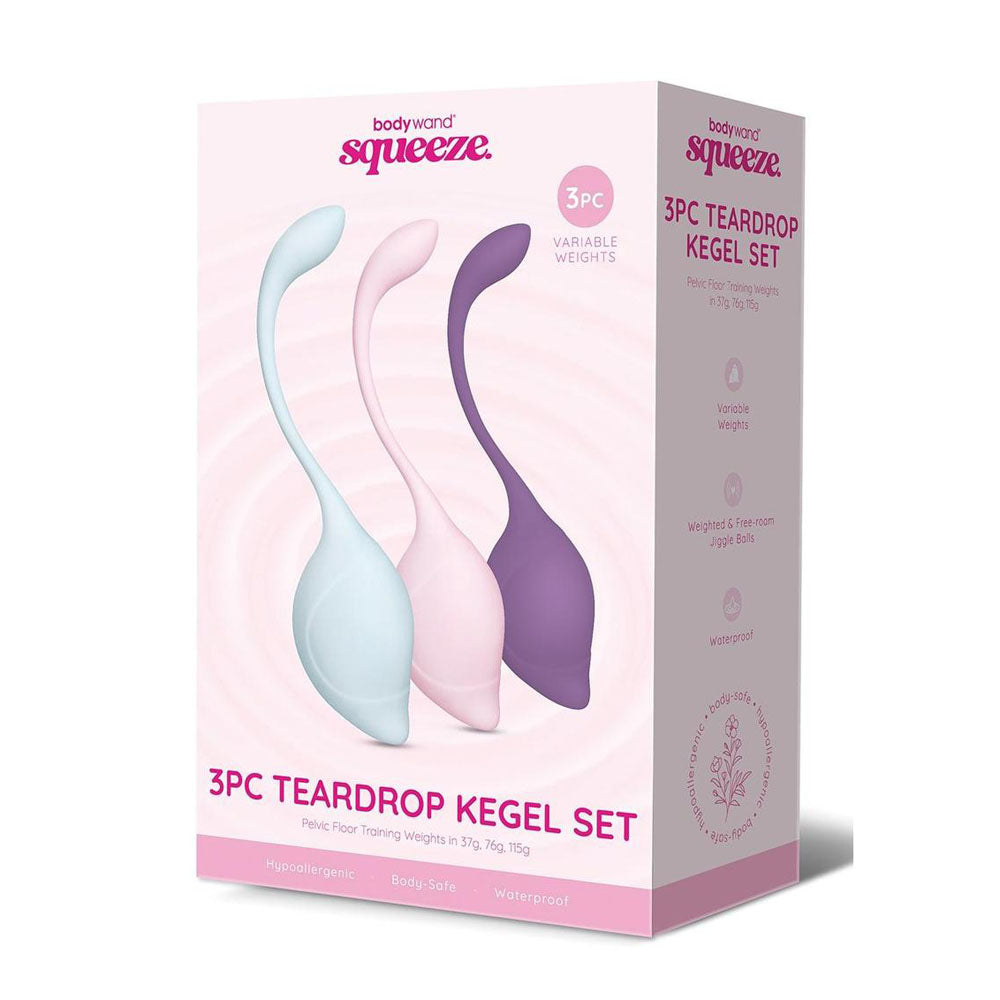 The image shows the Bodywand Squeeze 3pc Teardrop Kegel Set, featuring blue, pink, and purple teardrop-shaped Kegel balls with curved stems. The packaging highlights Variable Weights, Waterproof, and is crafted from body-safe silicone, ideal for pelvic floor strengthening.