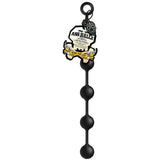 The Boneyard Ass Ballz M features four seamless black anal beads with a loop handle, made of hypoallergenic medical-grade silicone. They come in skull-shaped packaging labeled Ass Ballz and Bone For Life, accentuated with graphic skull and crossbones elements.